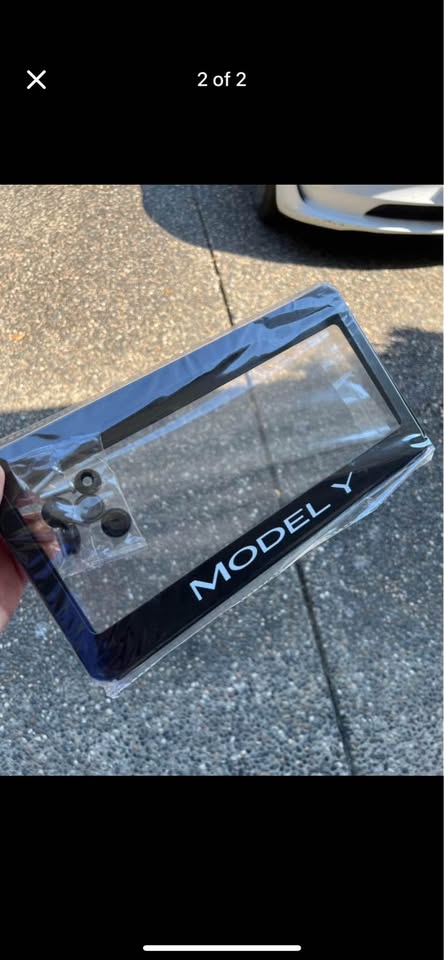 Actual black stainless steel frame with Model Y lettering, shown in its packaging